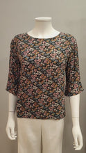 Load and play video in Gallery viewer, S/SLEEVE WITH RUFFLE FLORAL VISCOSE BLOUSE
